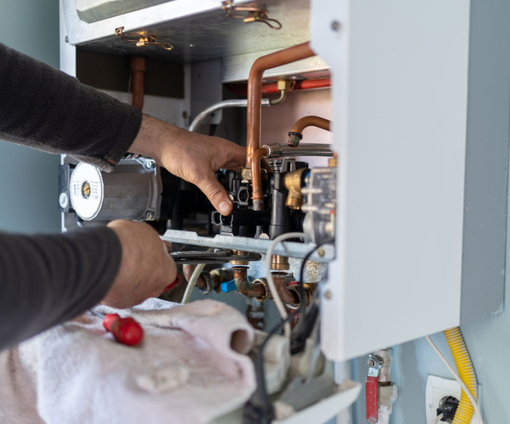 rh3 Technician checking air conditioning unit
